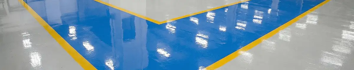 A factory floor professionally covered and marked with epoxy flooring in Orange, CA