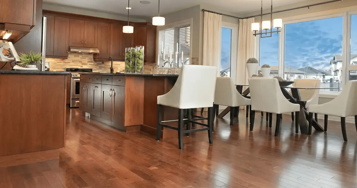 A modern kitchen with professionally installed wood flooring in Orange, CA