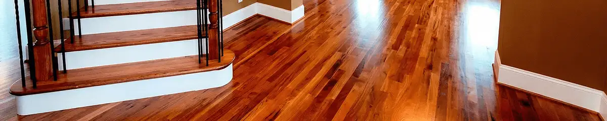 Base floor of a staircase with professionally restored wood flooring in Orange CA