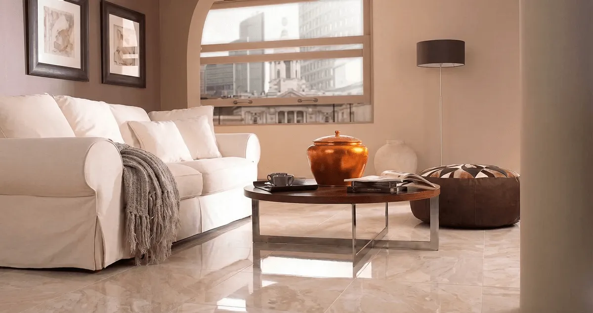 Modern living room with professionally installed marble flooring, a beige sofa, coffee table in Orange, CA