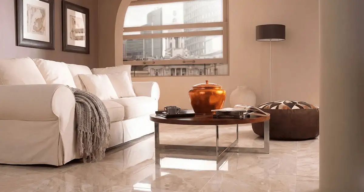 Modern living room with professionally installed marble flooring, a beige sofa, coffee table in Orange, CA