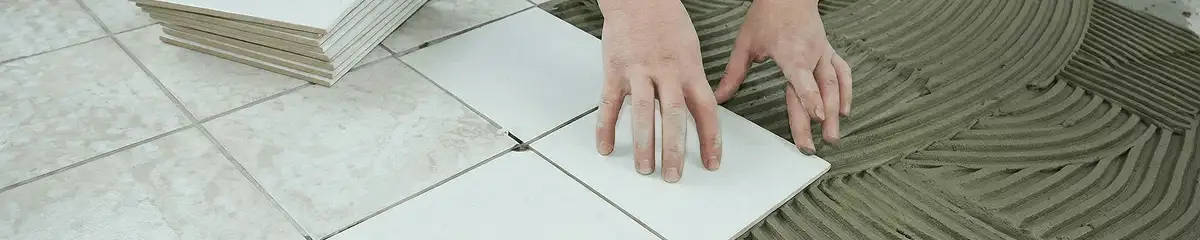 Professional installing white tile floors in Orange, CA